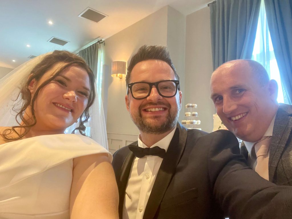 James Barlow with Wedding Couple – Cranage Hall, Cheshire - James Barlow - Wedding Singer James Barlow with the bride and groom at Cranage Hall in Cheshire, following live wedding entertainment and DJ services