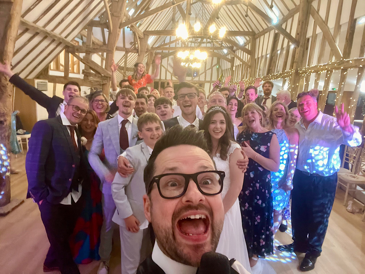James with the Wedding Party at Colville Hall – Wedding Singer & DJ James Barlow - James Barlow - Wedding Singer James Barlow with the wedding party at Colville Hall, Essex, after providing live music and DJ entertainment as a wedding singer and host