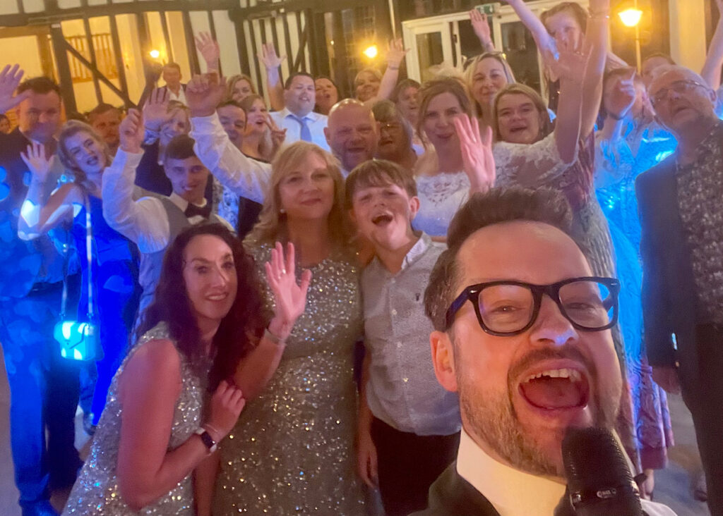 James Barlow with Wedding Party – The Warren Estate, Essex - James Barlow - Wedding Singer James Barlow with the wedding party at The Warren Estate in Maldon, Essex, after providing live music and DJ entertainment for the celebration