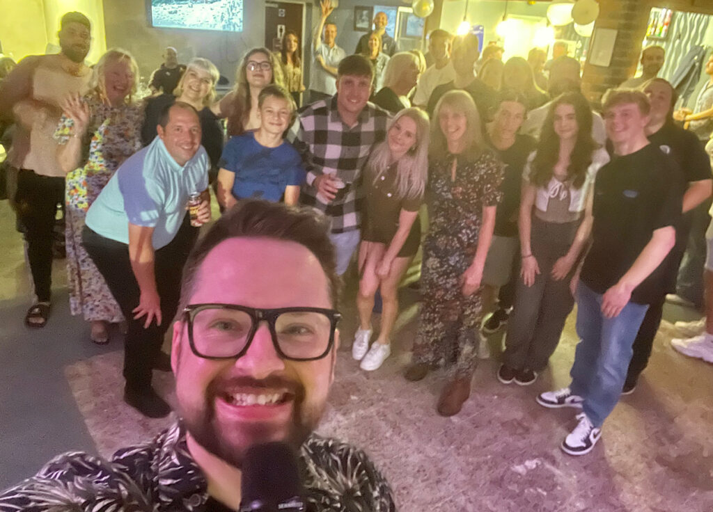 James Barlow Singing with Guests – Fillongley Cricket Club End of Season Party - James Barlow - Wedding Singer James Barlow singing alongside guests at the Fillongley Cricket Club End of Season Party, providing live music and entertainment during the celebration