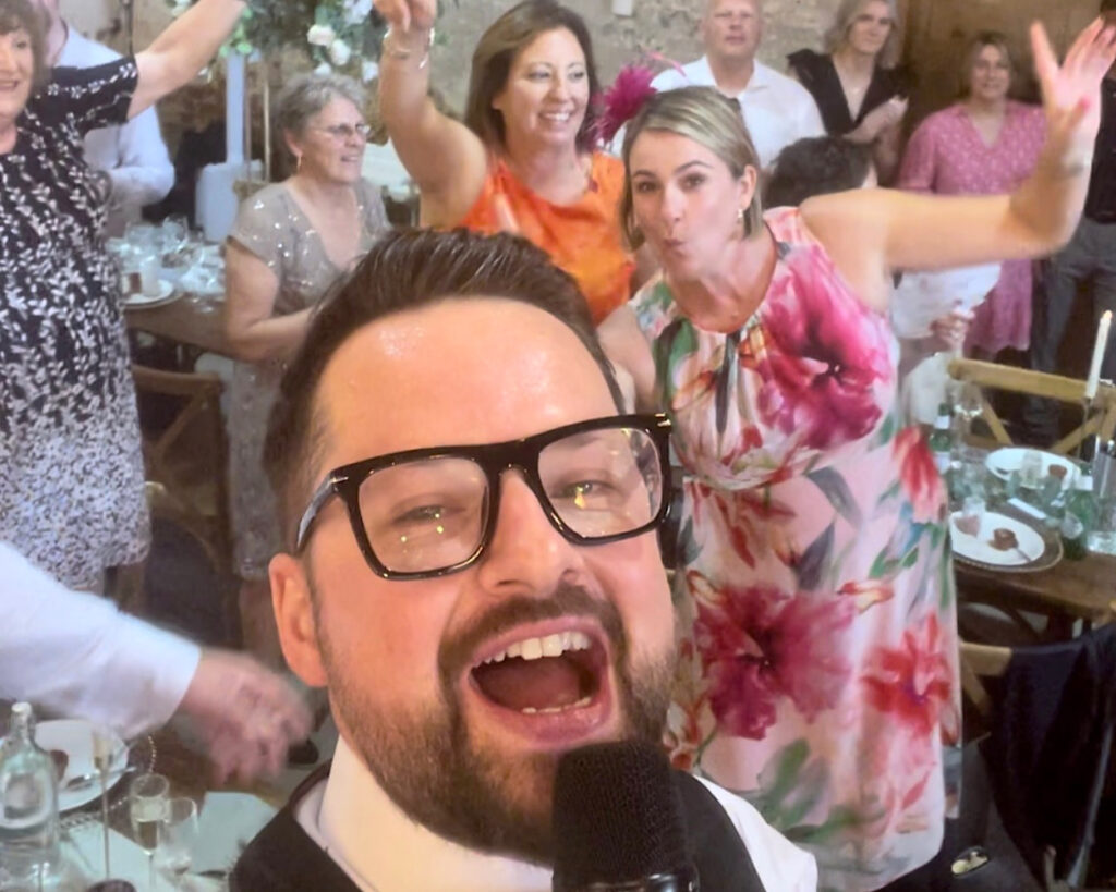 James Barlow with Wedding Party – The Riding School, Calke Abbey, Derbyshire – Wedding Singer & DJ - James Barlow - Wedding Singer James Barlow with the wedding party at The Riding School, Calke Abbey in Derbyshire, after providing live music and DJ entertainment for the celebration