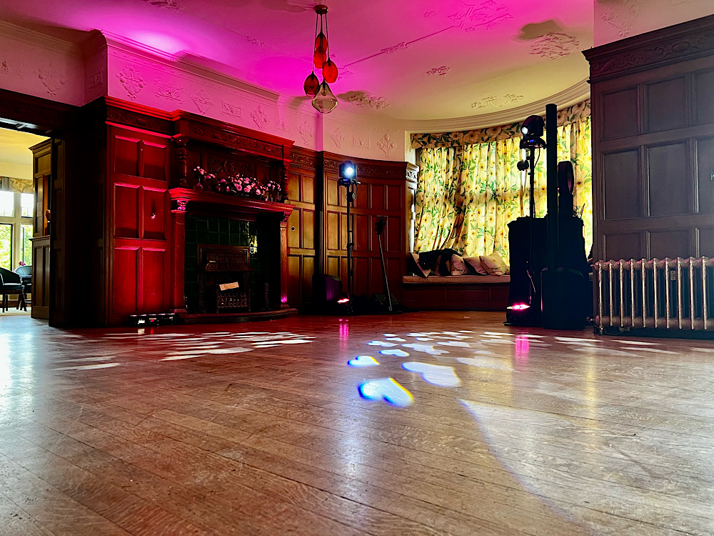 Wedding Lighting Setup – DJ & Event Production by James Barlow - James Barlow - Wedding Singer Professional wedding lighting setup provided by James Barlow, creating an atmospheric setting for the evening reception and dance floor